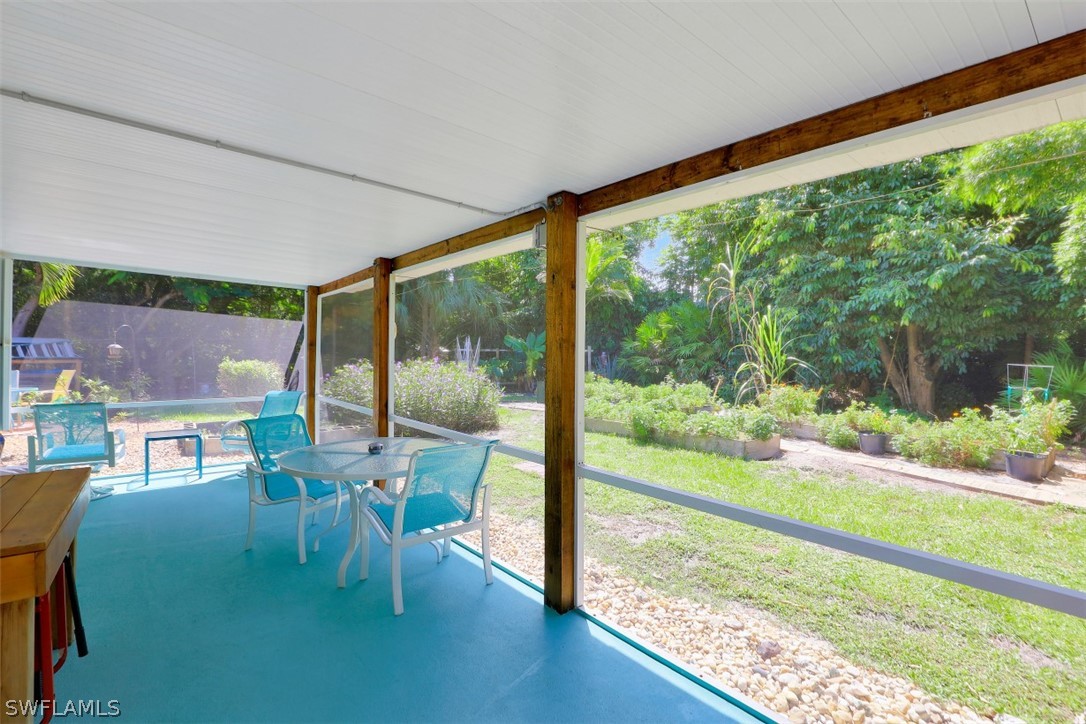 5807 Tarpon Road Bokeelia, FL 33922 - Photo 3 of 25 a balcony with chairs and a table