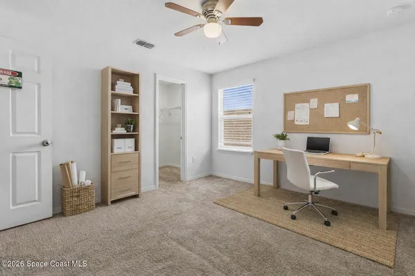 a workspace with furniture and window