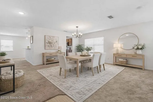 a view of a dining room with furniture