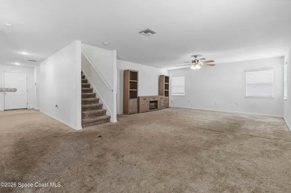 a view of a livingroom with a staircase