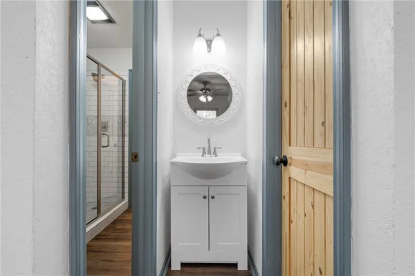 a bathroom with a sink and a mirror