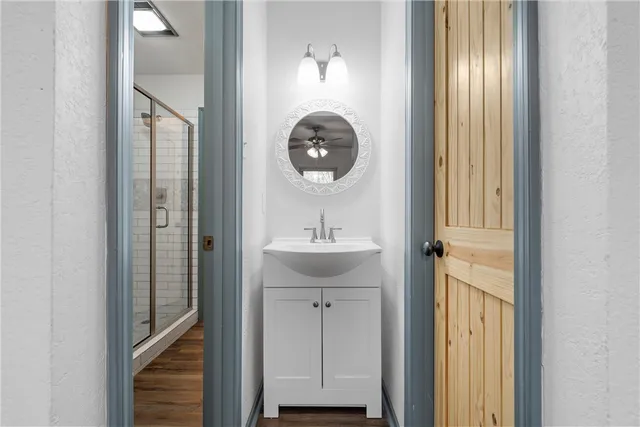 a bathroom with a sink and a mirror