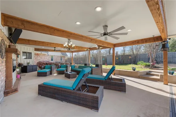 a outdoor space with patio lots of furniture and large windows