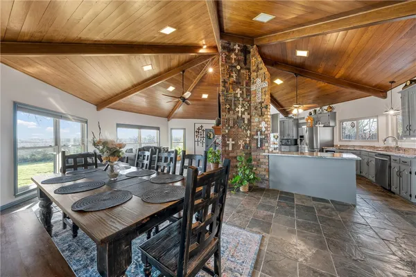 a outdoor dining space with furniture and a potted plant