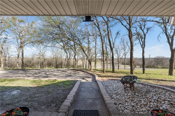 a view of yard with swimming pool and green space