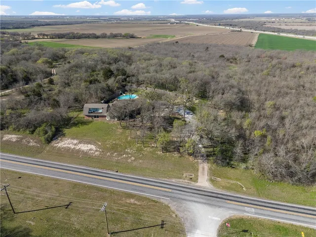 a view of a floor to ceiling window and a yard