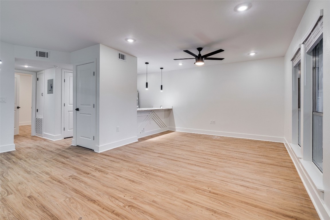 202 East 45th Street, Unit 202 Austin, TX 78751 - Photo 2 of 29 Unfurnished room featuring light wood finished floors, a ceiling fan, and recessed lighting
