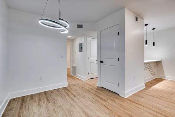 a view of a livingroom with wooden floor