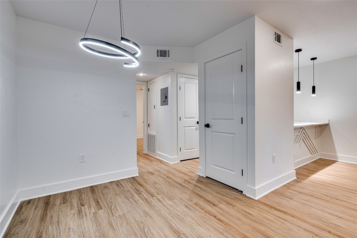 202 East 45th Street, Unit 202 Austin, TX 78751 - Photo 8 of 29 Unfurnished room featuring light wood-type flooring and baseboards
