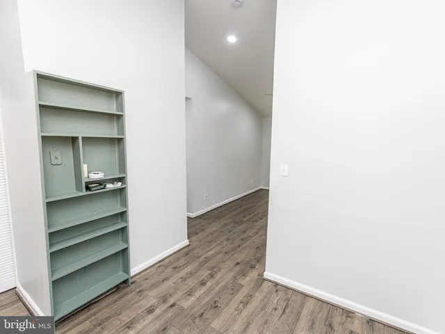 a view of gallery with wooden floor