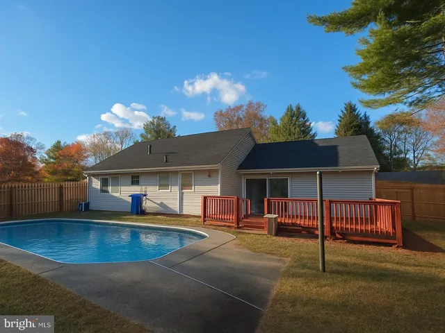 a view of a backyard with a large tree