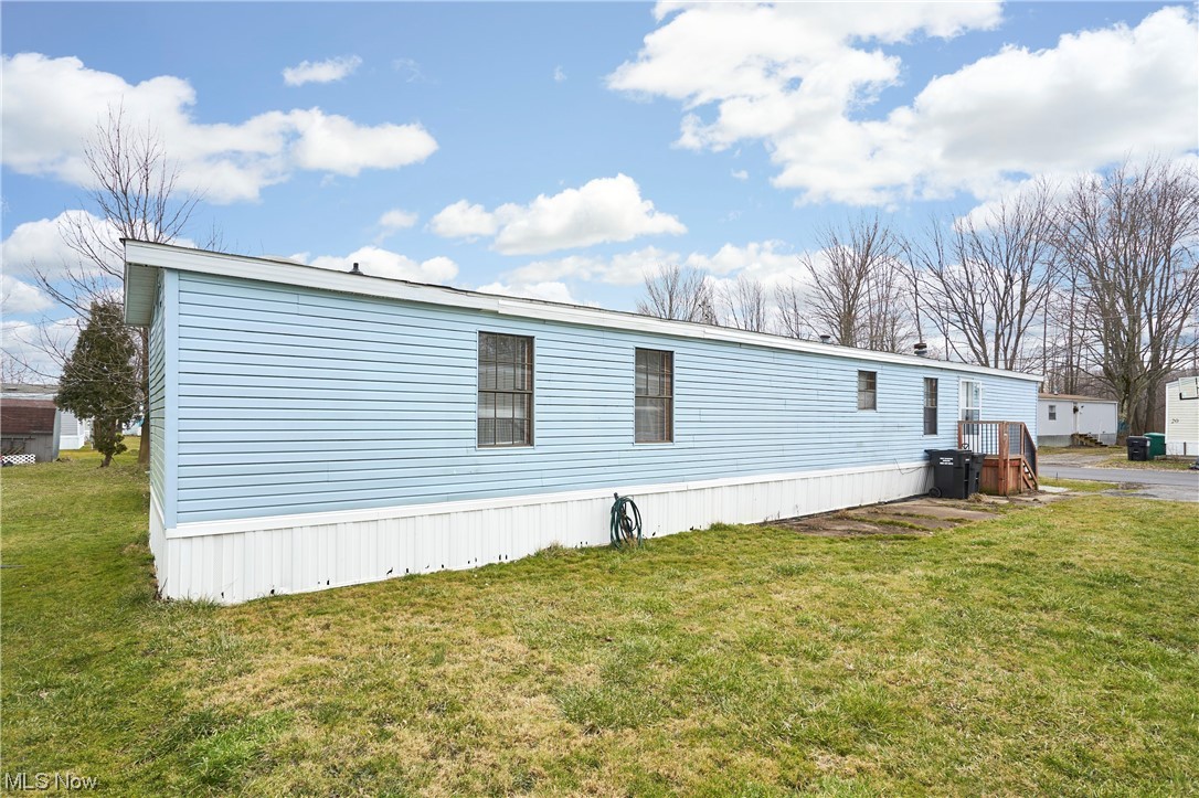45 Eddie Road Madison, OH 44057 - Photo 24 of 26 View of side of home with a lawn