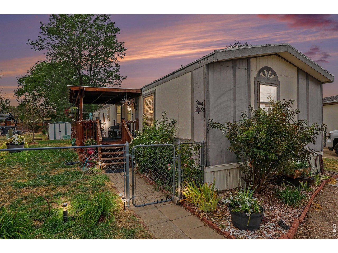 1401 9th Street, Unit 159 Fort Lupton, CO 80621 - Photo 18 of 24 Twilight view of the home.