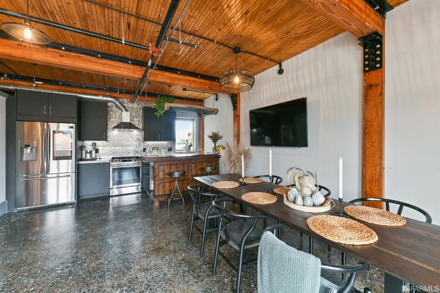 a dinning table and chairs in a kitchen