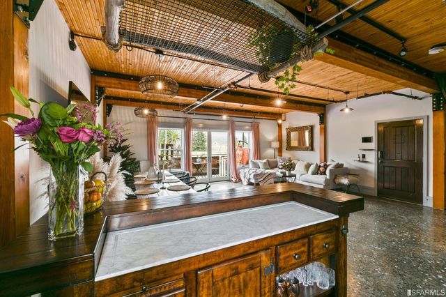 a room with dining table and chairs