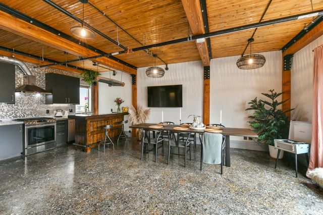 a view of a dining room with furniture window and outside view