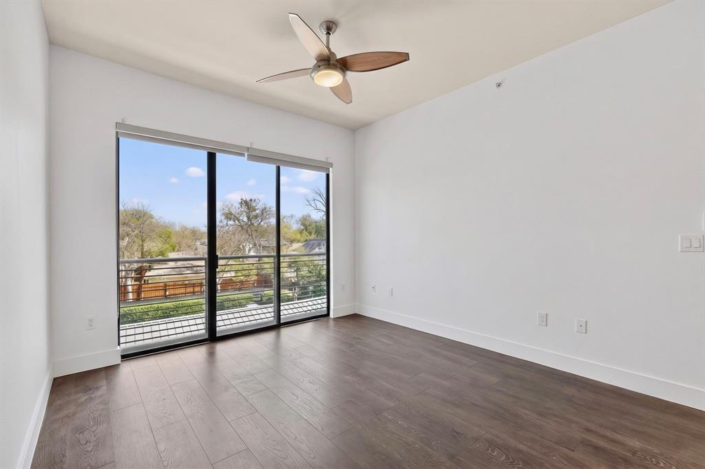 Floor-to-ceiling sliding glass doors with roller shades