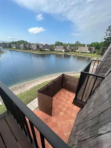 a view of swimming pool with a lake view