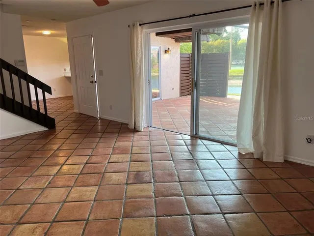 a kitchen with stainless steel appliances granite countertop a sink and stove top oven with wooden floor
