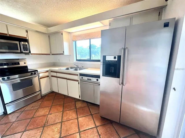 a view of an empty room with a fireplace