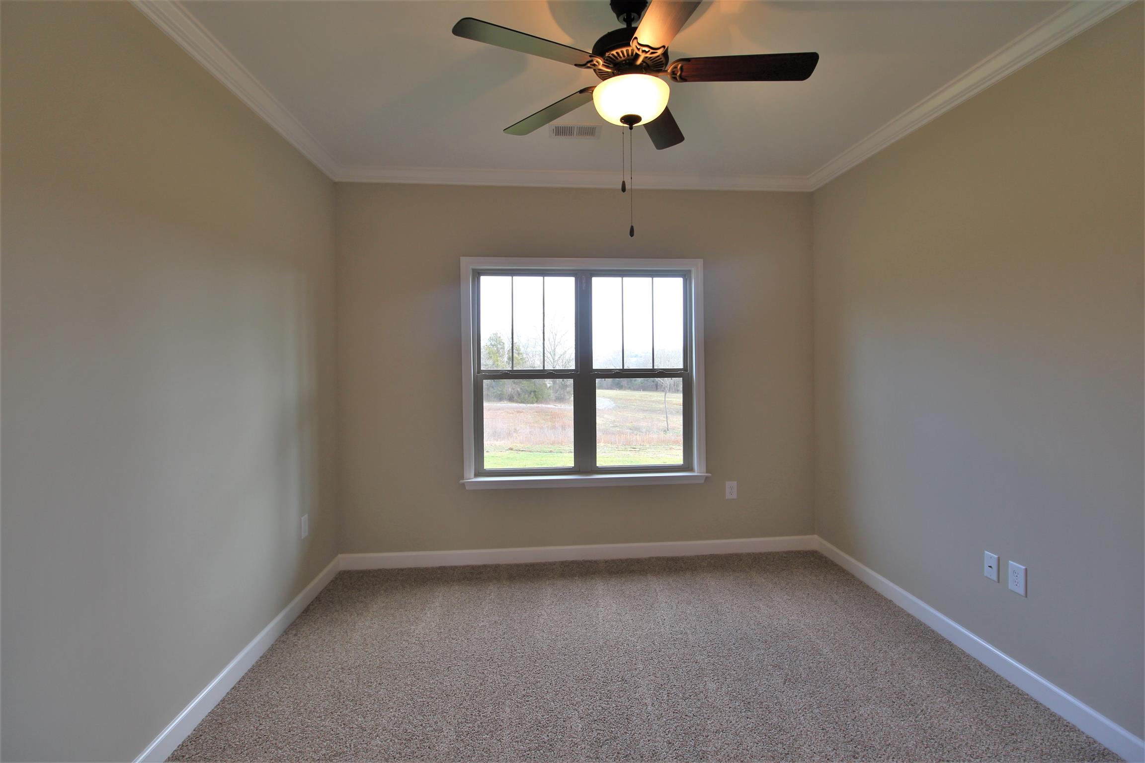 2139 Turner Road Watertown, TN 37184 - Photo 21 of 30 an empty room with a window and a fan