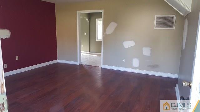 63 Ashley Road Edison, NJ 08817 - Photo 3 of 21 a view of a livingroom with wooden floor and a bathroom