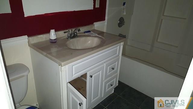 63 Ashley Road Edison, NJ 08817 - Photo 8 of 21 a bathroom with a sink and a mirror