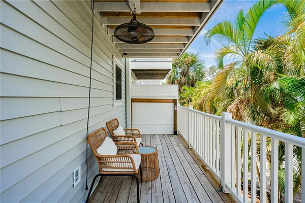 a view of a balcony with chairs