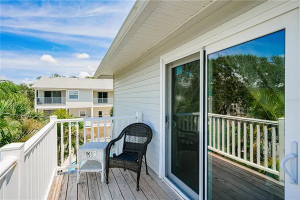 a view of a two chairs in the balcony