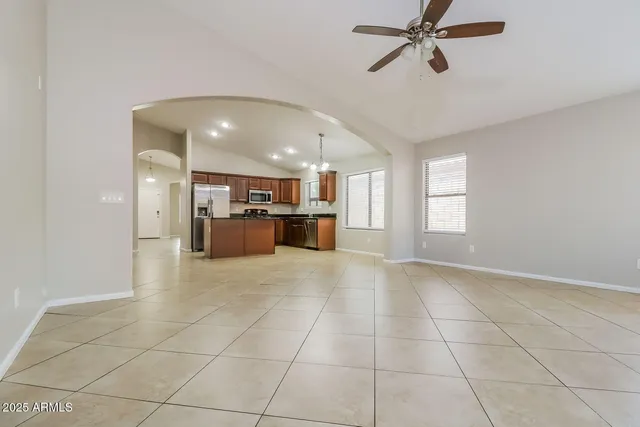 a view of a kitchen with a sink and a window
