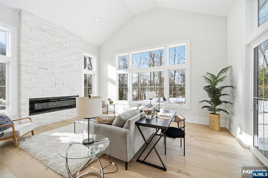 8 Montgomery Road Livingston, NJ 07039 - Photo 12 of 38 a living room with furniture and a large window