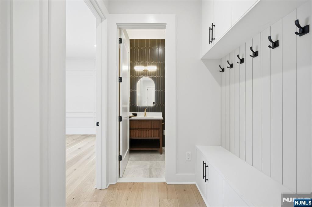 8 Montgomery Road Livingston, NJ 07039 - Photo 15 of 38 a bathroom with a tub and shower