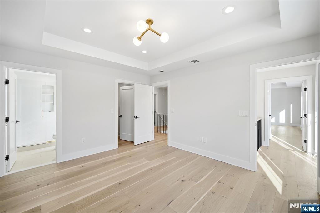 8 Montgomery Road Livingston, NJ 07039 - Photo 31 of 38 a view of a room with wooden floor