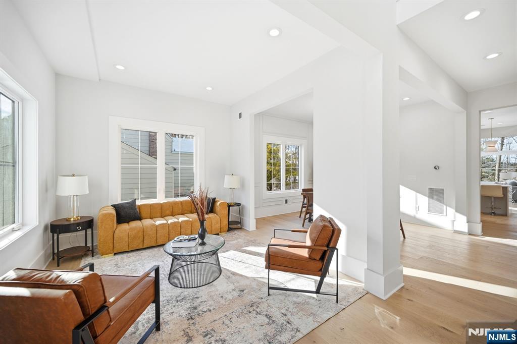 8 Montgomery Road Livingston, NJ 07039 - Photo 4 of 38 a living room with furniture and a large window
