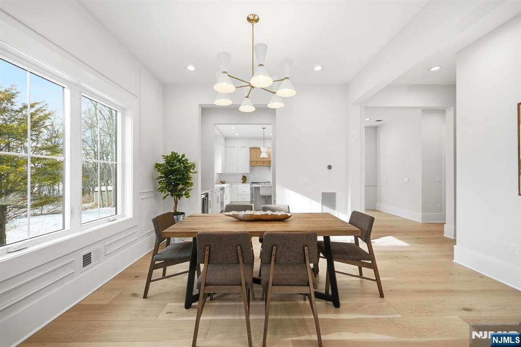 8 Montgomery Road Livingston, NJ 07039 - Photo 5 of 38 a view of a dining room with furniture window and wooden floor