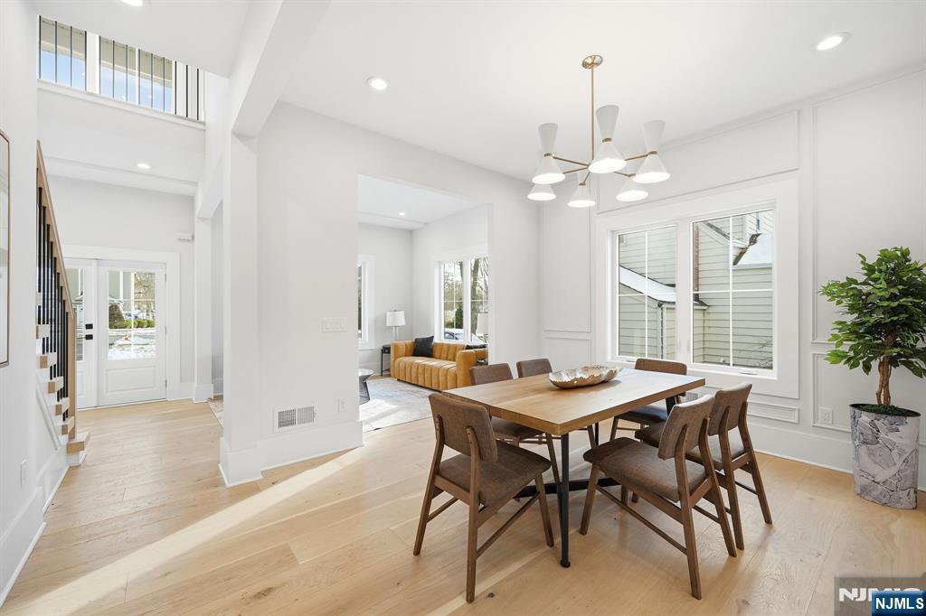 8 Montgomery Road Livingston, NJ 07039 - Photo 6 of 38 a dining room with a table and chairs