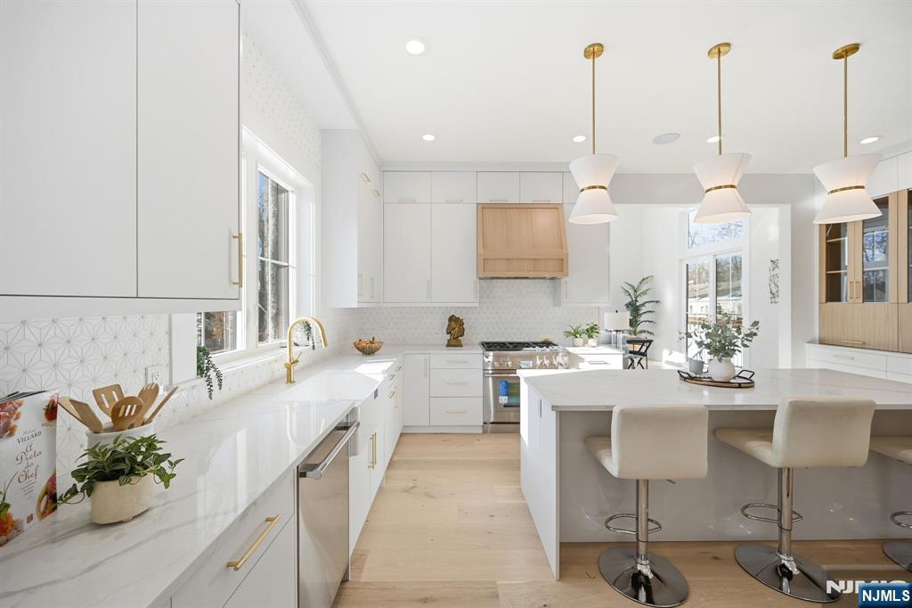 8 Montgomery Road Livingston, NJ 07039 - Photo 8 of 38 a large kitchen with lots of counter space and sink