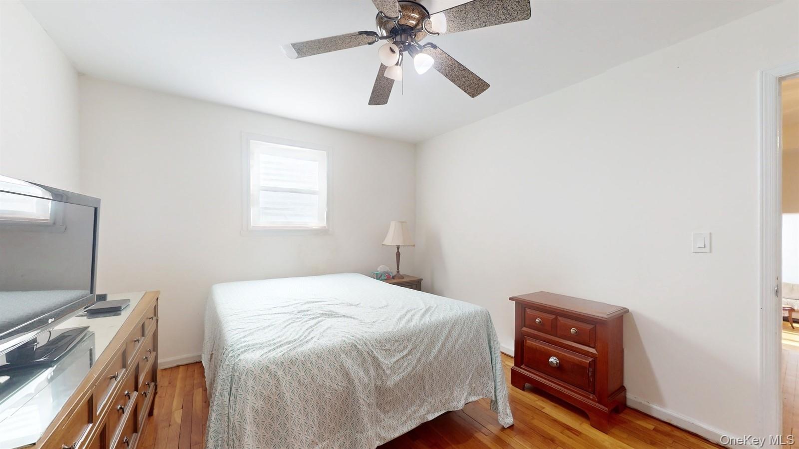 10 Rumbrook Road Elmsford, NY 10523 - Photo 11 of 25 Bedroom featuring light wood-type flooring and ceiling fan