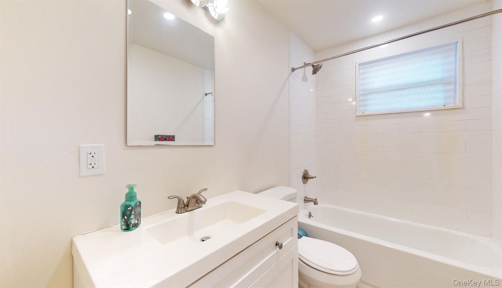 10 Rumbrook Road Elmsford, NY 10523 - Photo 14 of 25 Full bathroom featuring vanity, toilet, and tiled shower / bath