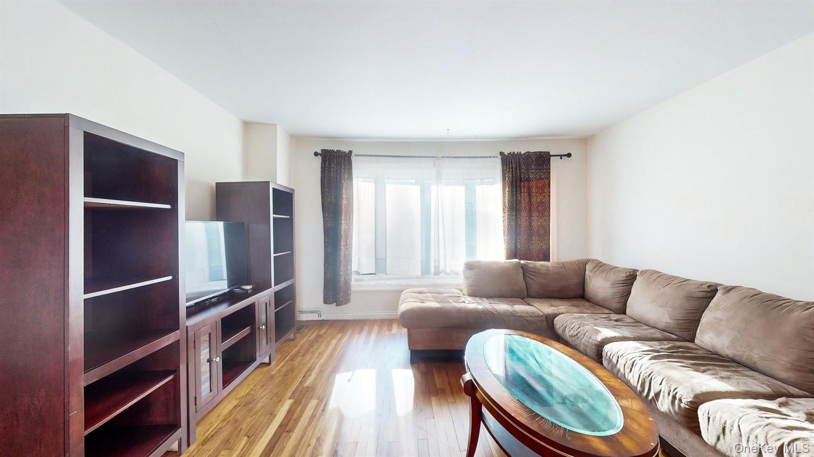 10 Rumbrook Road Elmsford, NY 10523 - Photo 4 of 25 Living room featuring light hardwood / wood-style flooring