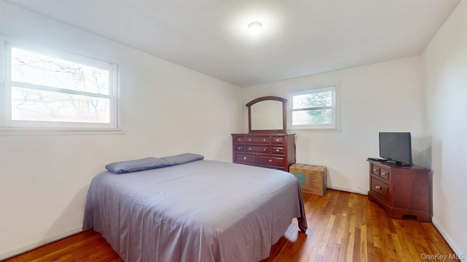 10 Rumbrook Road Elmsford, NY 10523 - Photo 10 of 25 Bedroom featuring hardwood / wood-style flooring