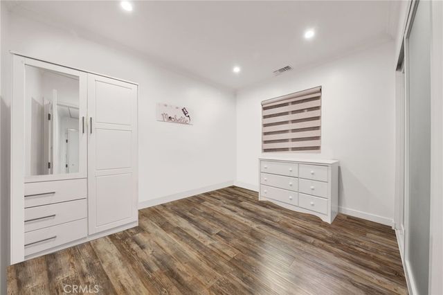 a white toilet sitting next to a bath tub