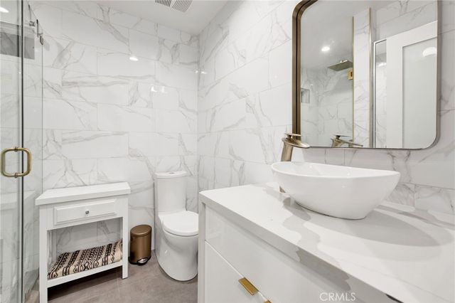 a bathroom with a sink a washer and dryer