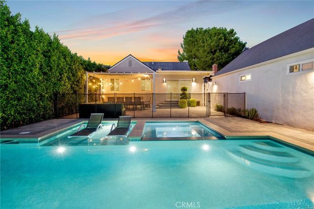 a view of a backyard with a patio