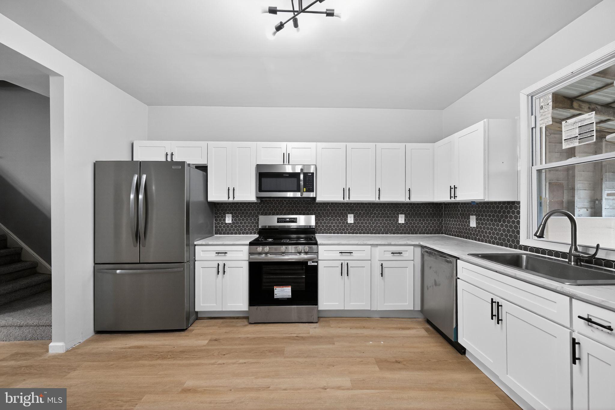 1122 Buttonwood Street Lebanon, PA 17046 - Photo 3 of 13 Modern kitchen with sleek finishes.