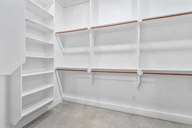 a view of an empty walk in closet