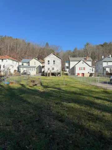 a view of a house with a big yard
