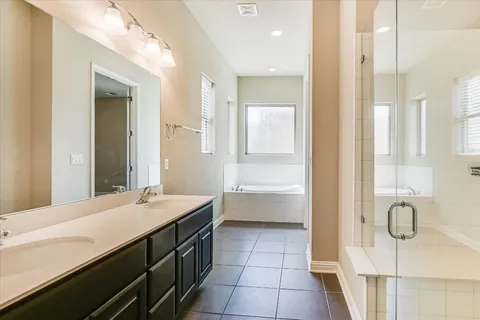 a bathroom with a sink a vanity and a mirror