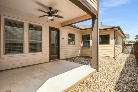 a front view of a house with a ceiling fan