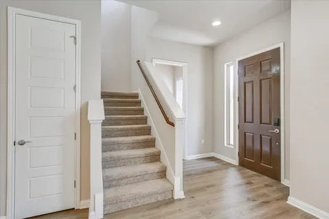 a view of entryway with wooden floor